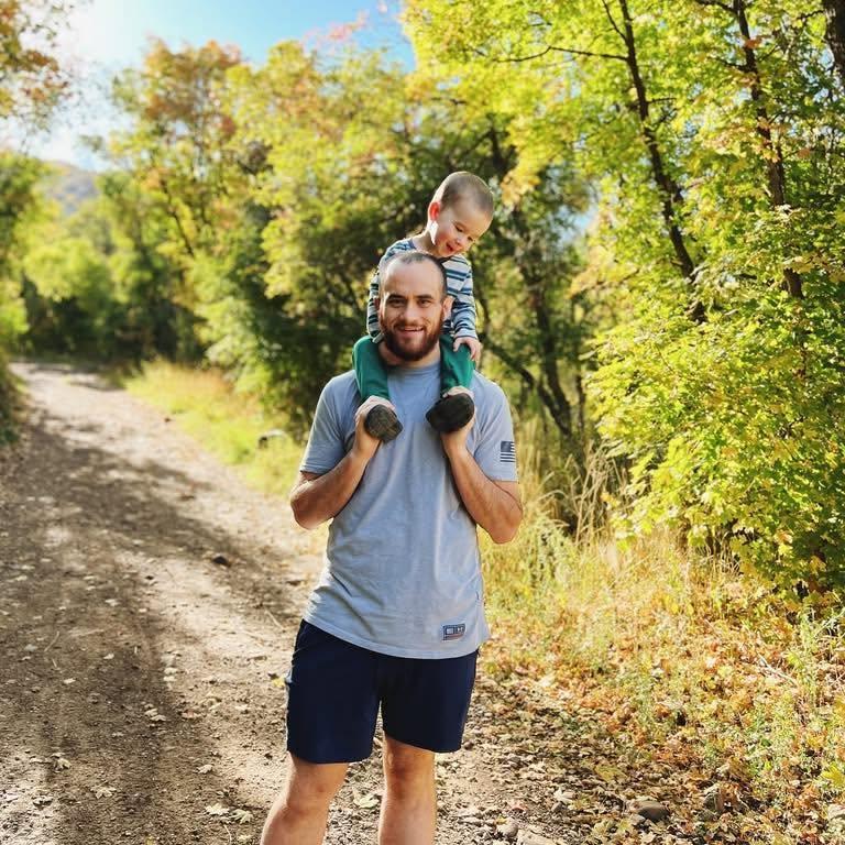 Logan, founder of Peak Views Digital, out on a hiking trail